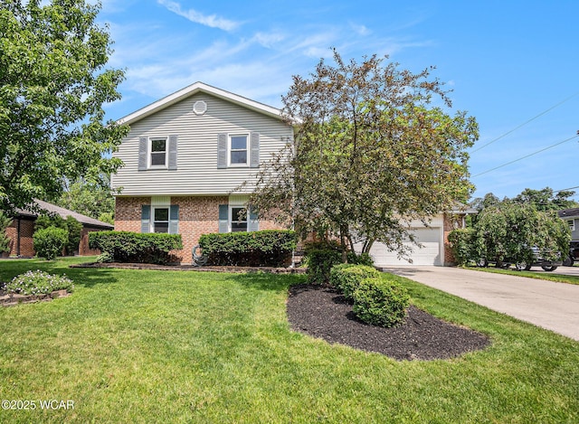 2069 High Ridge Rd, Lima, OH 45805 - view of front facade featuring brick siding, driveway, a front yard, and a garage