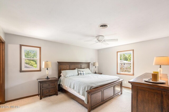 2069 High Ridge Rd, Lima, OH 45805 - bedroom with light colored carpet, multiple windows, and a ceiling fan
