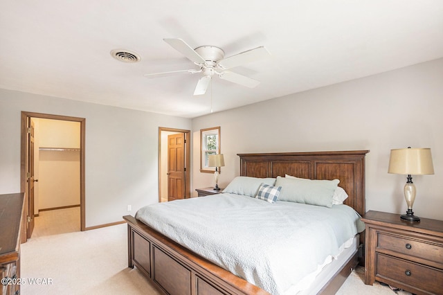 2069 High Ridge Rd, Lima, OH 45805 - bedroom featuring light colored carpet, a spacious closet, a ceiling fan, and a closet