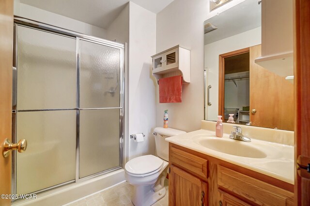 bathroom featuring sink, toilet, and walk in shower