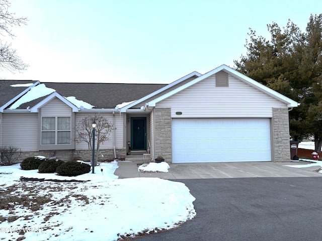 ranch-style house featuring a garage