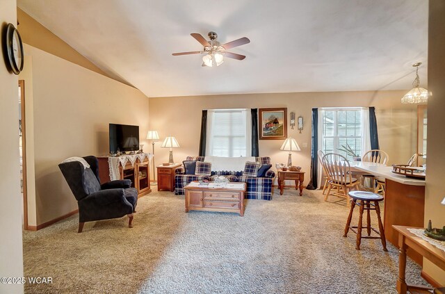 kitchen with hanging light fixtures, dark carpet, and electric stove