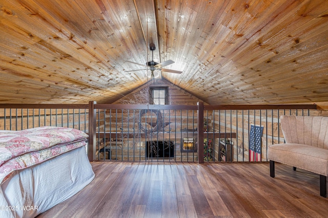 unfurnished bedroom featuring lofted ceiling, wood finished floors, and wood ceiling