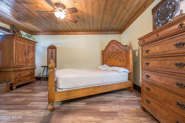 bedroom featuring baseboards, ceiling fan, wood ceiling, ornamental molding, and light wood-style flooring