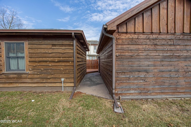 view of home's exterior with fence