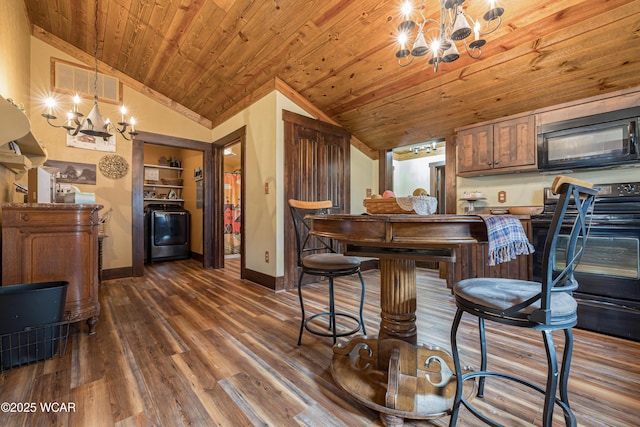 kitchen featuring wood ceiling, vaulted ceiling, black appliances, and an inviting chandelier