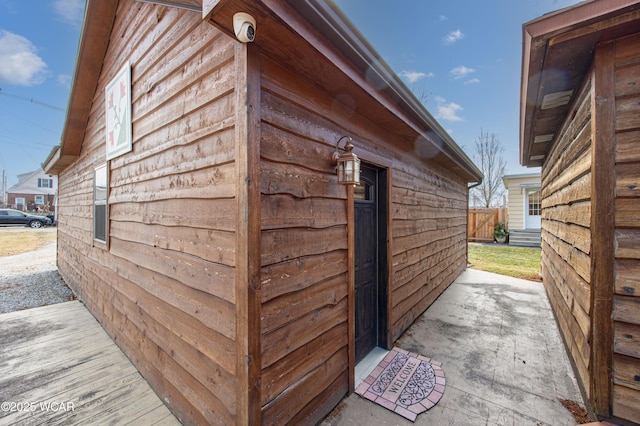 view of home's exterior with fence