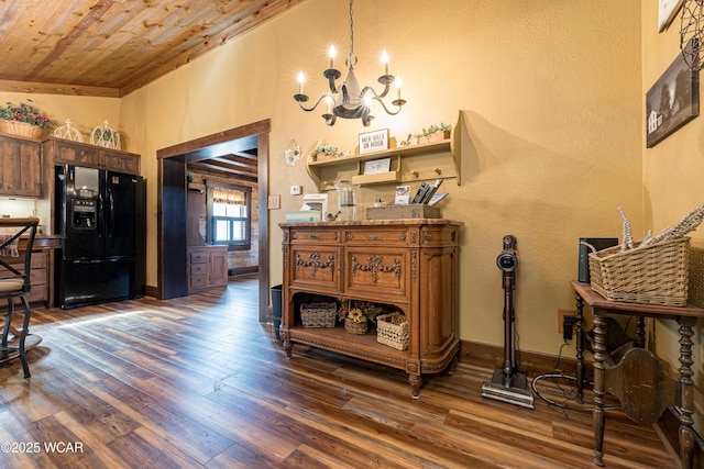 interior space with wooden ceiling, dark wood-style floors, baseboards, and a chandelier