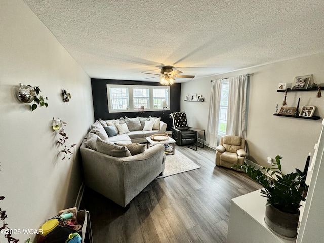 111 E Ottawa-Glandorf Rd, Ottawa, OH 45875 - living room with a textured ceiling, wood finished floors, a healthy amount of sunlight, and ceiling fan