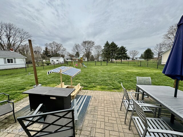 111 E Ottawa-Glandorf Rd, Ottawa, OH 45875 - view of patio with fence, outdoor dining area, and a playground