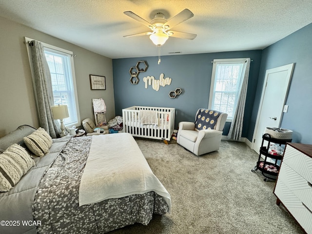 111 E Ottawa-Glandorf Rd, Ottawa, OH 45875 - carpeted bedroom with a textured ceiling, visible vents, and ceiling fan