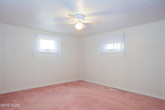 unfurnished room with carpet floors and ceiling fan