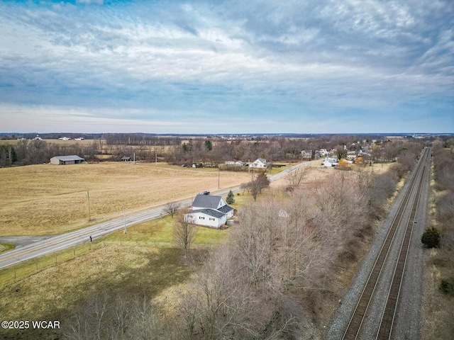 birds eye view of property with a rural view