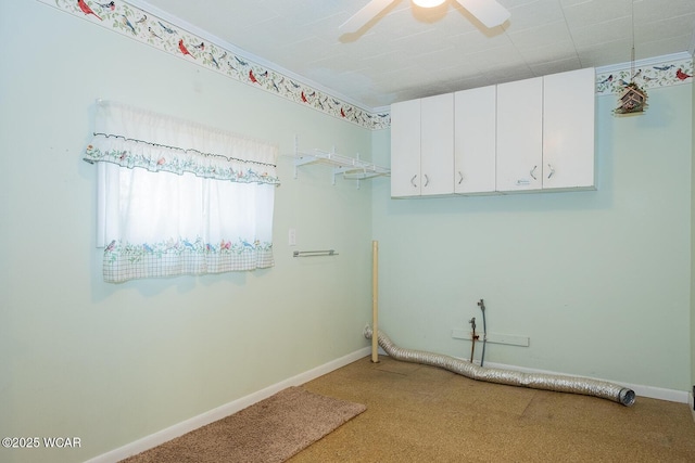 laundry room featuring ceiling fan and carpet floors