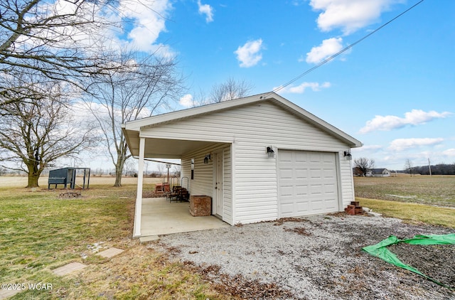 garage with a lawn