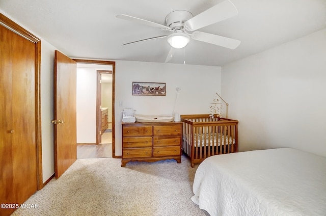 bedroom with light carpet and ceiling fan