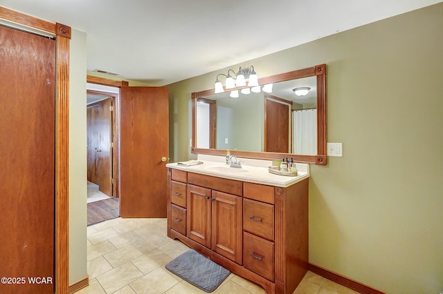 bathroom featuring vanity and tile patterned flooring