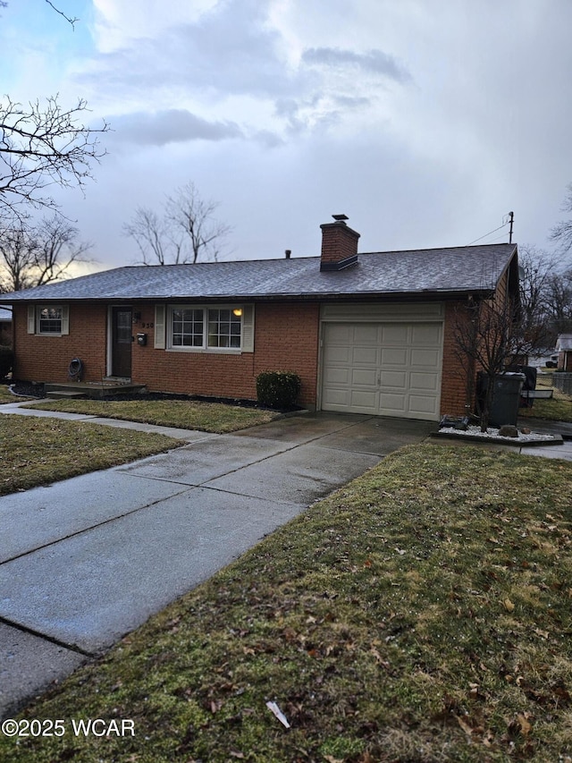 single story home with driveway, a front lawn, a chimney, and an attached garage