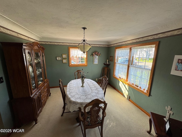 242 S Main St, Ottawa, OH 45875 - dining room with light colored carpet and a textured ceiling