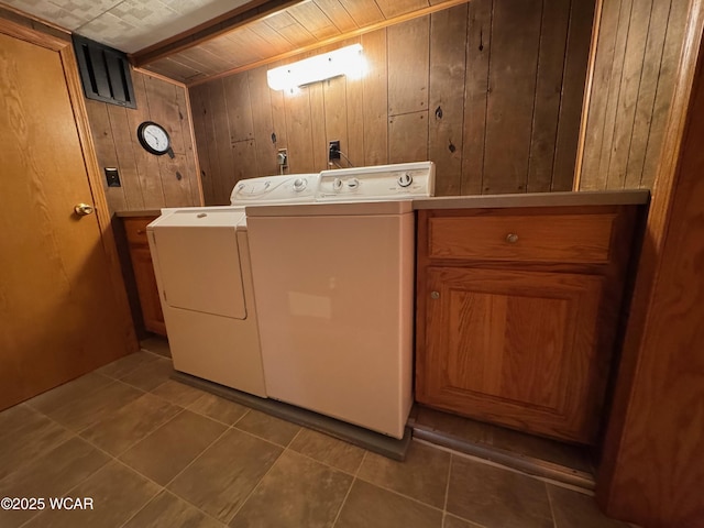 242 S Main St, Ottawa, OH 45875 - laundry room featuring wood walls, washing machine and dryer, and tile patterned floors