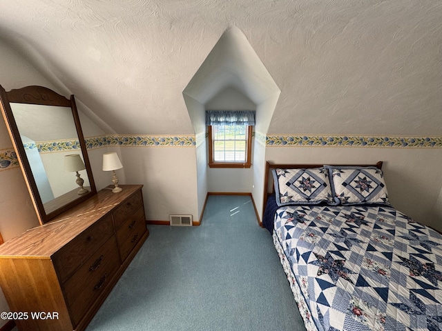 242 S Main St, Ottawa, OH 45875 - unfurnished bedroom with vaulted ceiling, carpet, and a textured ceiling