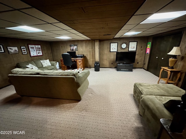 242 S Main St, Ottawa, OH 45875 - carpeted living room with a drop ceiling, a desk, and wood walls