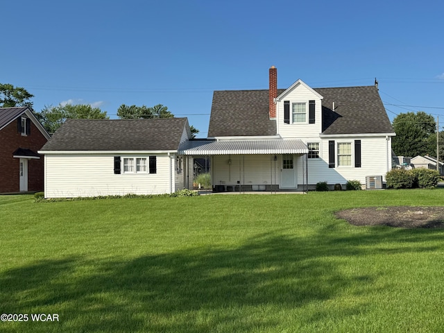 242 S Main St, Ottawa, OH 45875 - rear view of house with a yard, a chimney, and roof with shingles