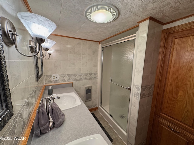 242 S Main St, Ottawa, OH 45875 - bathroom featuring tile walls, crown molding, a shower stall, and vanity