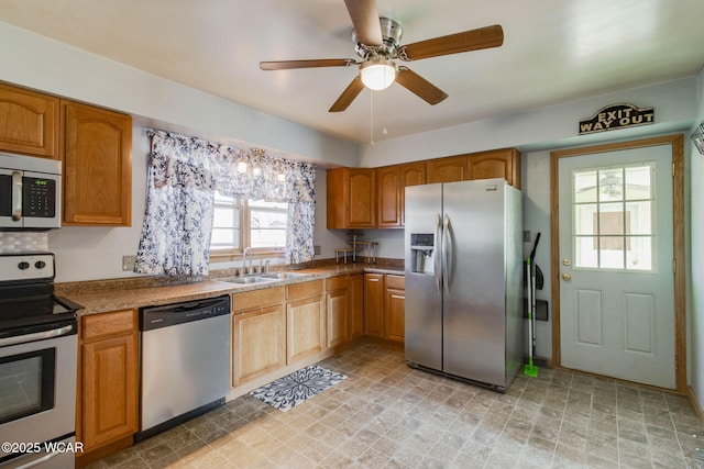 kitchen featuring sink, ceiling fan, and appliances with stainless steel finishes