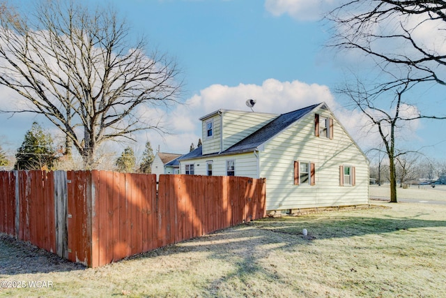 view of home's exterior with a lawn