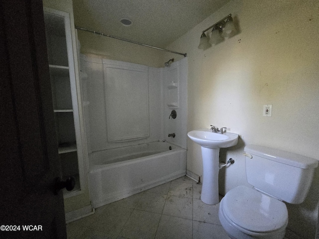 bathroom with  shower combination, a sink, and toilet