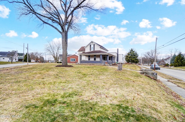 bungalow-style house featuring a front yard