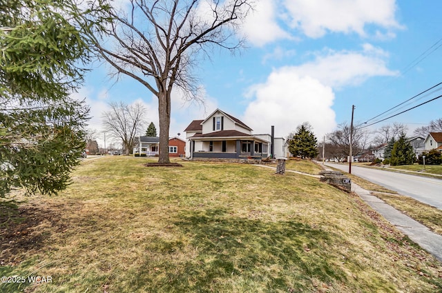 bungalow-style house with a front lawn