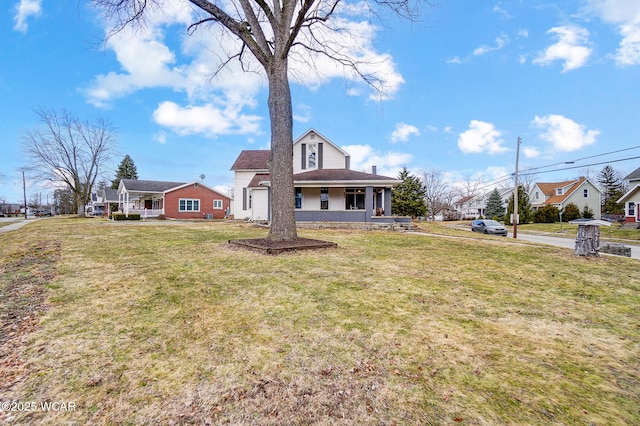 view of front of house with a front lawn and a porch