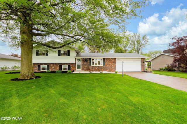 2440 E Bluelick Rd, Lima, OH 45801 - split level home with an attached garage, concrete driveway, a front yard, and brick siding