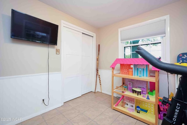 2440 E Bluelick Rd, Lima, OH 45801 - game room featuring tile patterned flooring and a wainscoted wall