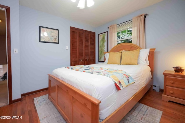 2440 E Bluelick Rd, Lima, OH 45801 - bedroom featuring wood finished floors, a closet, and baseboards