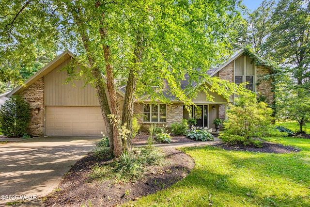 800 Heritage Dr, Lima, OH 45804 - mid-century modern home with a garage, driveway, brick siding, and a front lawn