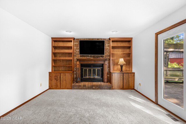 800 Heritage Dr, Lima, OH 45804 - unfurnished living room with carpet, a brick fireplace, and built in features