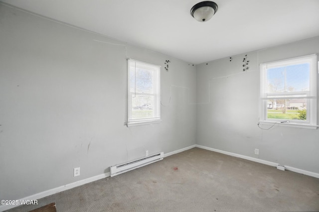 402 S Fifth St, Continental, OH 45831 - carpeted empty room with a baseboard radiator, a wealth of natural light, and baseboards
