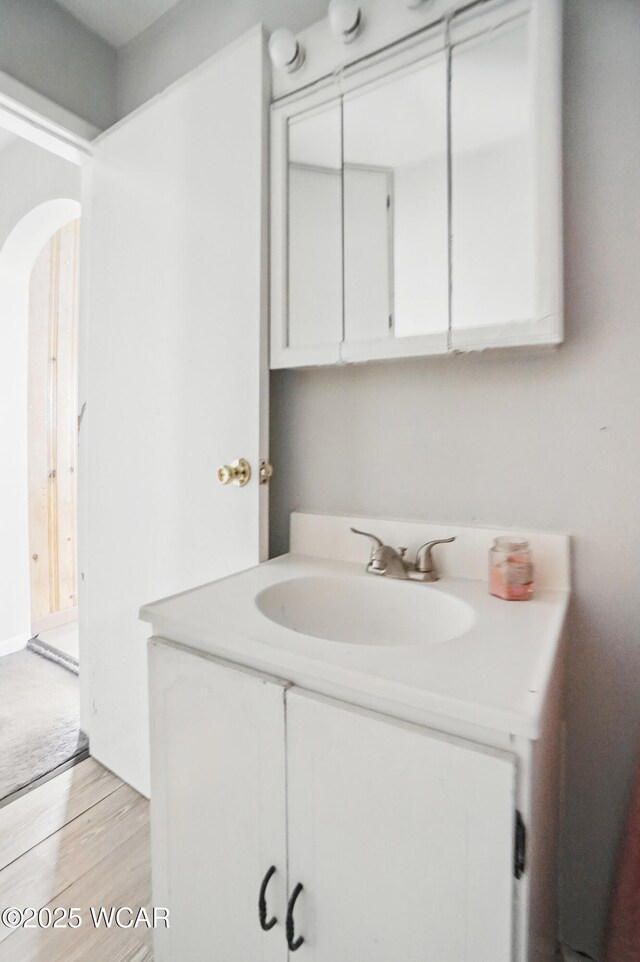 402 S Fifth St, Continental, OH 45831 - bathroom featuring wood finished floors and vanity