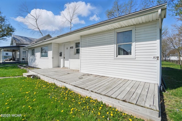 402 S Fifth St, Continental, OH 45831 - view of front facade with a wooden deck and a front lawn