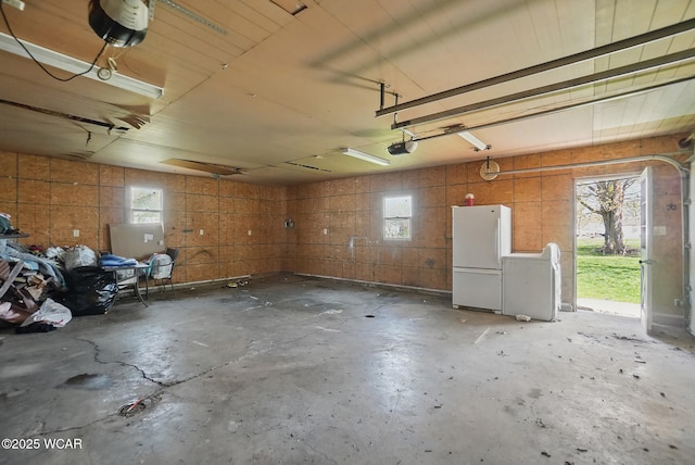 402 S Fifth St, Continental, OH 45831 - garage with freestanding refrigerator and a garage door opener