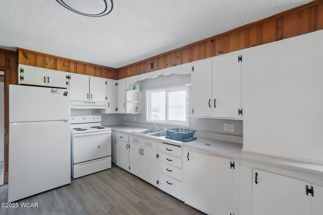 402 S Fifth St, Continental, OH 45831 - kitchen with under cabinet range hood, open shelves, white appliances, a textured ceiling, and wood finished floors