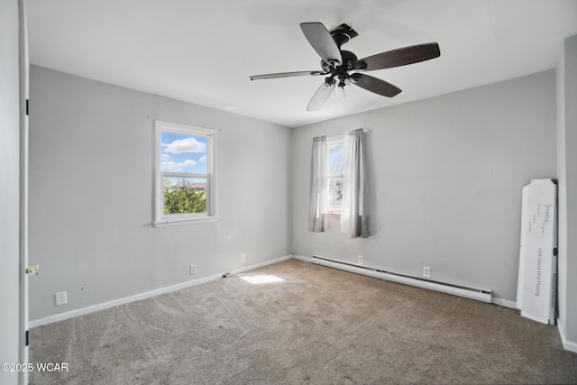 402 S Fifth St, Continental, OH 45831 - spare room featuring ceiling fan, carpet flooring, baseboard heating, and baseboards
