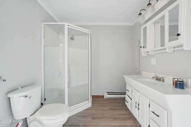 402 S Fifth St, Continental, OH 45831 - bathroom featuring a baseboard radiator, wood finished floors, vanity, and a stall shower