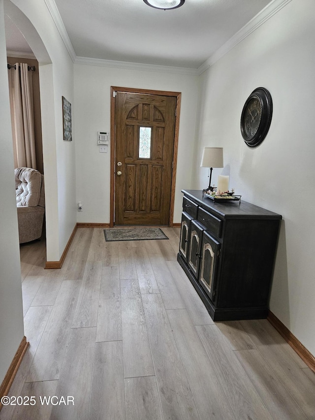 1756 Jo Jean Rd, Lima, OH 45806 - foyer entrance with arched walkways, light wood-type flooring, and crown molding