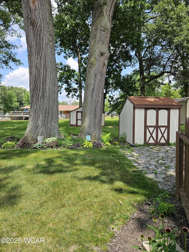 1756 Jo Jean Rd, Lima, OH 45806 - view of green lawn featuring a storage unit