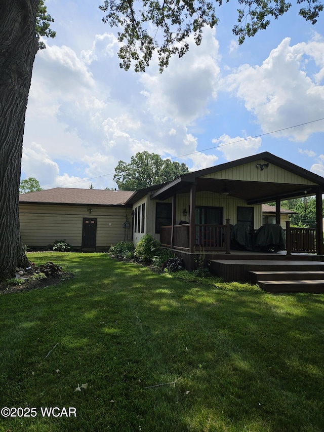 1756 Jo Jean Rd, Lima, OH 45806 - back of house featuring a yard and a wooden deck
