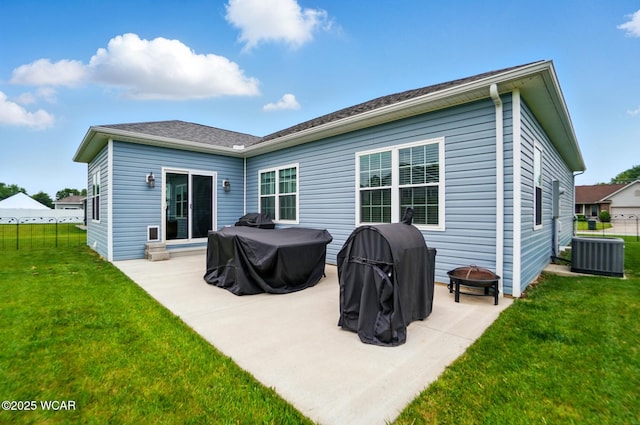3467 Weldon Dr, Lima, OH 45806 - rear view of property with a fire pit, cooling unit, and a patio area